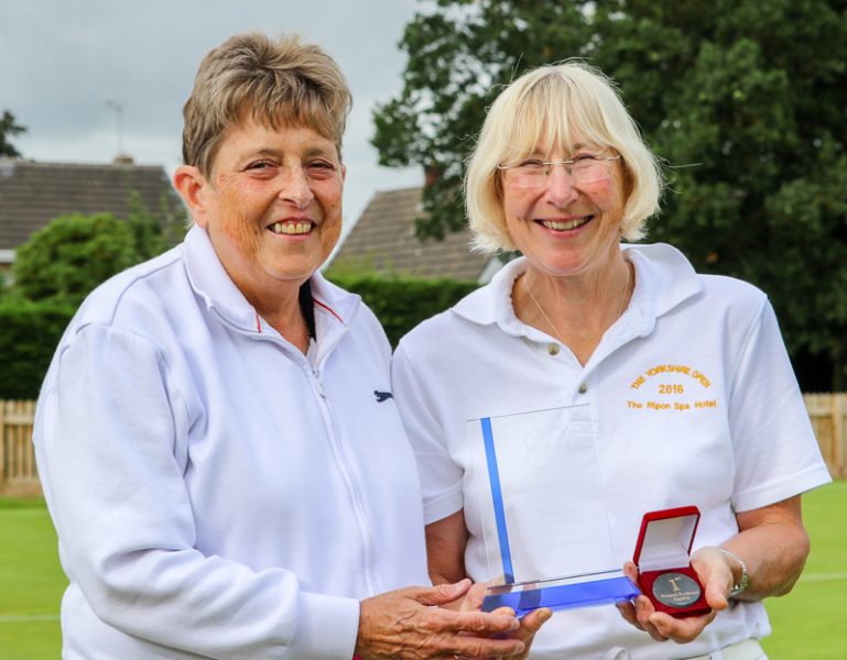 Maggie Cowman presents the inaugural trophy to Kath Wright